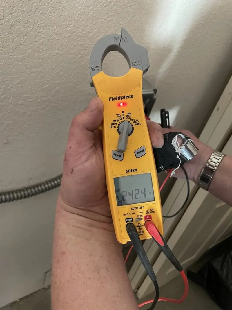 Voltage testing with clamp meter during Electrical Installation Services in Lehi
